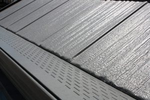 Close up of steel gutter covers installed on a seamless gutter system