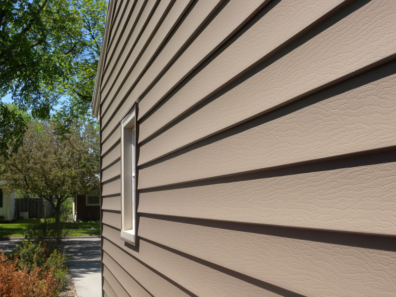 Seamless steel siding in ABC's Canyon color.