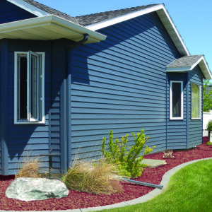 A home with classic blue siding from ABC Seamless of Nebraska.