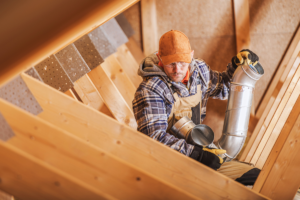 contractor inspects roof ventilation