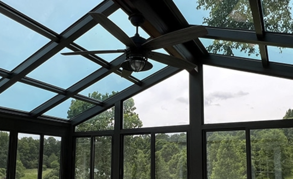 a solarium style sunroom with cathedral ceiling