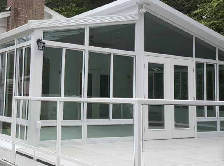 A California room with white aluminum framing and adjacent patio