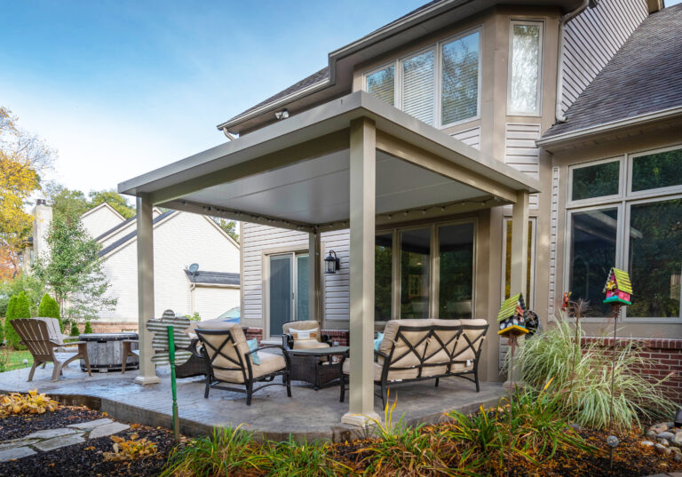 sleek patio cover in white vinyl over furniture with fire pit