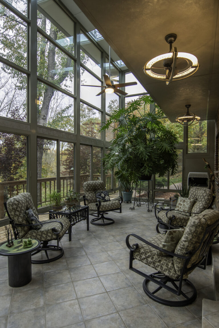 cozy sunroom interior with modern light fixture