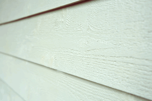 close up of fiber cement siding in off white color